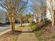 Landscaped community walkway with mature trees at 1674 Snowmass Way, Durham, NC 27713