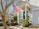 Inviting exterior featuring a charming front porch and well-manicured landscaping at 1674 Snowmass Way, Durham, NC 27713