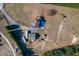 Aerial view of house, detached garage, RV, and surrounding property at 35 Winners Cir, Louisburg, NC 27549