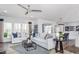 Spacious living room with light sofas, a large TV, and a cozy fireplace at 47 Rosedale Way, Pittsboro, NC 27312
