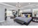 Spacious main bedroom with a plush bed and plenty of natural light at 47 Rosedale Way, Pittsboro, NC 27312