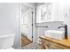 Clean bathroom featuring a vessel sink and wood vanity at 5205 Rembert Dr, Raleigh, NC 27612