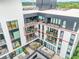 Aerial view of apartment building highlighting private balconies at 523 S West St # 402, Raleigh, NC 27601