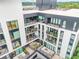 Aerial view of apartment building showcasing multiple balconies and courtyard at 523 S West St # 402, Raleigh, NC 27601