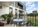Private balcony with city view and small table and chairs at 523 S West St # 402, Raleigh, NC 27601