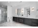 Modern bathroom with double vanity and marble floors at 523 S West St # 402, Raleigh, NC 27601