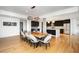 Modern dining room with a live-edge table and gray velvet chairs at 523 S West St # 402, Raleigh, NC 27601