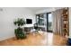 Home office with balcony access and built-in shelving at 523 S West St # 402, Raleigh, NC 27601