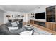 Modern living room featuring a curved sofa and built-in shelving at 523 S West St # 402, Raleigh, NC 27601