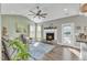 Cozy living room with fireplace, vaulted ceiling, and hardwood floors at 58 Grazing Meadows Dr, Angier, NC 27501