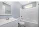 Modern bathroom with a shower/tub combo and white vanity at 722 Martin St, Durham, NC 27704