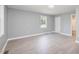 Spacious bedroom with gray walls and wood-look floors at 722 Martin St, Durham, NC 27704