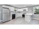 Modern kitchen with white cabinets, quartz countertops and stainless steel appliances at 722 Martin St, Durham, NC 27704