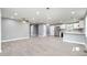 Open concept kitchen with white cabinets and stainless steel appliances at 722 Martin St, Durham, NC 27704