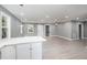 Open concept kitchen with white cabinets and island at 722 Martin St, Durham, NC 27704