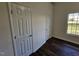 Bedroom with hardwood floors and double closets at 104 Annotto Bay Ln, Garner, NC 27529