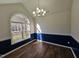 Bright dining room with hardwood floors, large window, and elegant chandelier at 104 Annotto Bay Ln, Garner, NC 27529