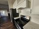 Modern kitchen with stainless steel appliances and quartz countertops at 104 Annotto Bay Ln, Garner, NC 27529