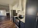 Modern kitchen features stainless steel appliances and dark cabinets at 104 Annotto Bay Ln, Garner, NC 27529