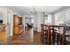 Dining area with hardwood floors, built-in hutch, and table with chairs at 1261 N Nc 49, Burlington, NC 27217