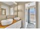 Modern bathroom with double vanity and shower at 1516 Pearces Rd, Zebulon, NC 27597