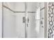 Clean shower with glass enclosure and tiled walls at 1516 Pearces Rd, Zebulon, NC 27597