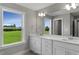 Double vanity bathroom with a large mirror and modern fixtures at 1803 Ballard Rd # Holly Craftsman, Fuquay Varina, NC 27526