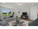 Relaxing bonus room with a sofa, coffee table, and large screen TV at 1817 Ballard Rd # Selma English Country, Fuquay Varina, NC 27526