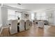 Bright dining area with hardwood floors and stylish light fixture at 209 Bog Hill Ln, Cary, NC 27519