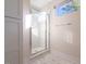 Modern bathroom with a walk-in shower and marble tile at 2407 Hart St # A, Durham, NC 27703