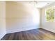 Simple bedroom with hardwood floors and a window at 2407 Hart St # A, Durham, NC 27703