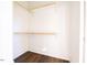 Walk in closet with wood shelving and hardwood floor at 2407 Hart St # A, Durham, NC 27703