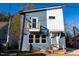 Modern two-story home with blue siding and a balcony at 2407 Hart St # A, Durham, NC 27703