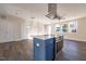 Open concept kitchen with island and stainless steel appliances at 2407 Hart St # A, Durham, NC 27703