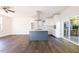 Open concept kitchen with island and hardwood floors at 2407 Hart St # A, Durham, NC 27703