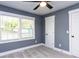 Cozy bedroom with neutral walls and carpet flooring at 313 E Mcclanahan St, Oxford, NC 27565