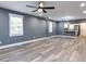 Spacious living room with hardwood floors and ceiling fan at 313 E Mcclanahan St, Oxford, NC 27565