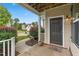 Inviting front porch with dark brown door and decorative landscaping at 3832 Stovall Dr, Haw River, NC 27258