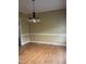 Bright dining room with hardwood floors and chandelier at 4904 Arbor Chase Dr, Raleigh, NC 27616