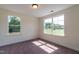 Bright bedroom with carpet flooring and large windows offering natural light at 6100 Sunset Lake Road Rd, Fuquay Varina, NC 27526