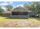 Home exterior with screened porch and lawn at 625 Green Willow Cir, Wendell, NC 27591