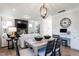 Bright dining room with a large table and adjacent living area at 65 Vili Dr, Broadway, NC 27505