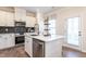 Modern kitchen with stainless steel appliances and white cabinetry at 65 Vili Dr, Broadway, NC 27505