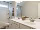 Clean bathroom with double vanity, updated fixtures, and shower/tub combo at 71 Victory View W Ter, Smithfield, NC 27577