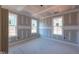 Bright bedroom featuring multiple windows and new flooring. Still under construction at 80 Purslane Dr, Franklinton, NC 27525