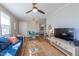 Open living area with a blue sofa, dining area, and kitchen view at 817 Daniels # B, Raleigh, NC 27605