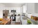 Modern kitchen with white cabinets and granite countertops at 835 Graham St, Burlington, NC 27217