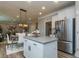 Open concept kitchen with island and view into living area at 817 Heartpine Dr, Mebane, NC 27302
