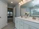 Double vanity bathroom with a view into a bedroom at 817 Heartpine Dr, Mebane, NC 27302