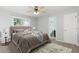 Comfortable main bedroom with a plush bed and ensuite bathroom access at 205 Esteban Ct, Mebane, NC 27302